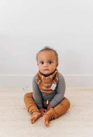 Baby boy colored organics joggers and long sleeve with rust colored bib 